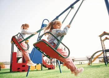 enjoying-swing-ride-kids-are-having-fun-playground_Easy-Resize.com